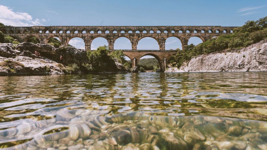 photo of Pont du Gard in France with river in foreground